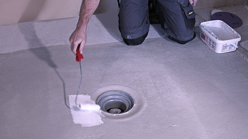 Fitting the glued flange to a floor drain
